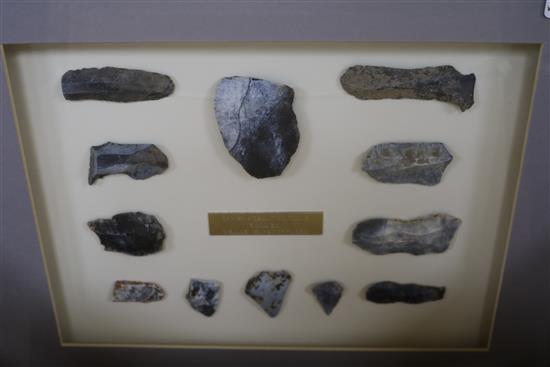 A collection of framed Neolithic and other tools and flint arrow heads,